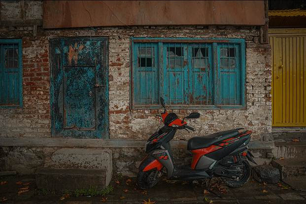 Weathered doors and motorcycle